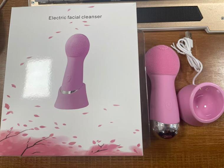 Electric facial cleanser with charging base